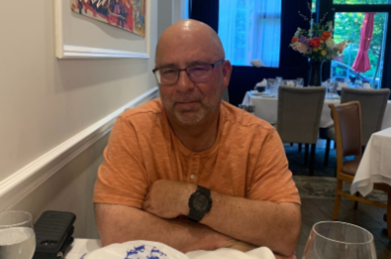 John Frotton, a 66-year-old chemical engineer from East Stroudsburg, Pennsylvania, sits at a restaurant dining table.