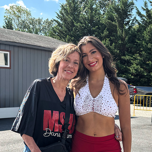 Hackensack Meridian Health patient, Erika Sharples, posing with her daughter at a dance competition.