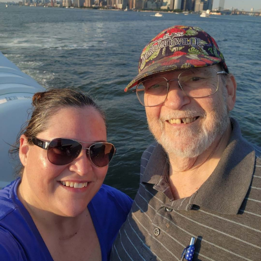 Image shows Hackensack Meridian Health patient, Tony Wozniak posing on a boat with his daughter.