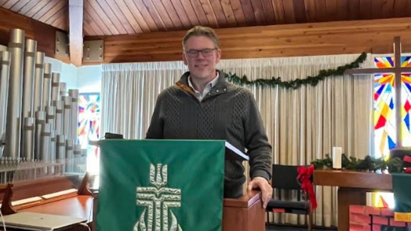 Image shows Pastor and Hackensack Meridian Health patient Todd Schumpert standing at the pulpit.
