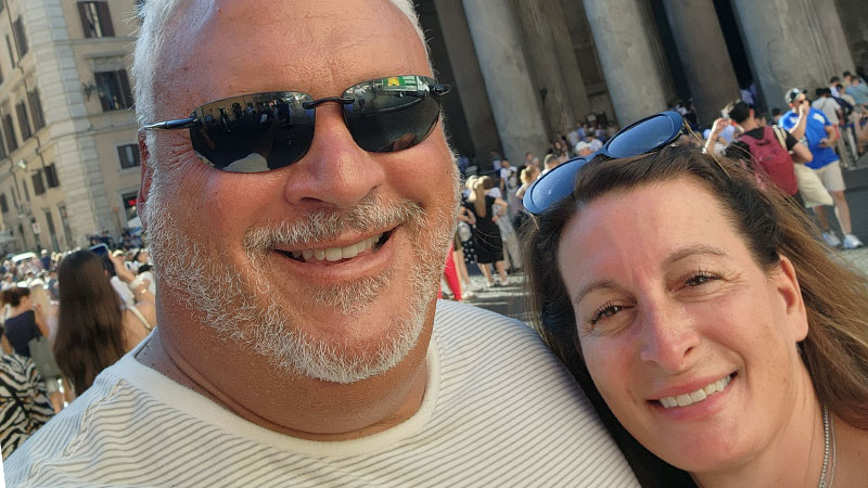 Image shows Hackensack Meridian health patient, Alex Scherer posing for a selfie with his wife.