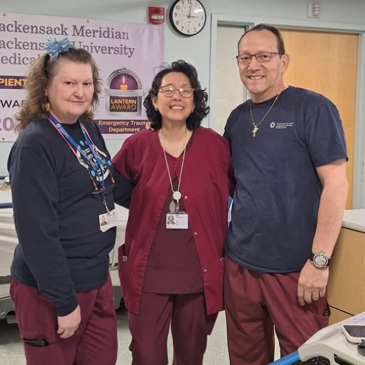Andie, patient care technician in the pediatric emergency department at Joseph M. Sanzari Children’s Hospital, smiles at the camera.