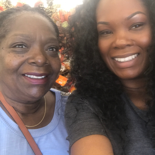Curlean Phillips and her daughter, Chanda, smile at the camera.