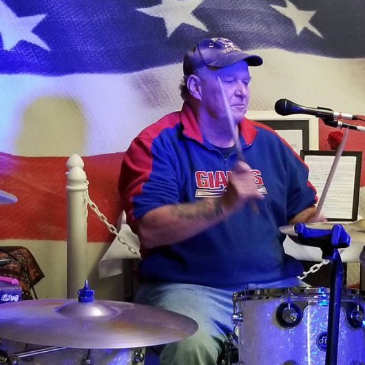 Patrick Connelly, 64, of Middletown, New Jersey, plays the drums.