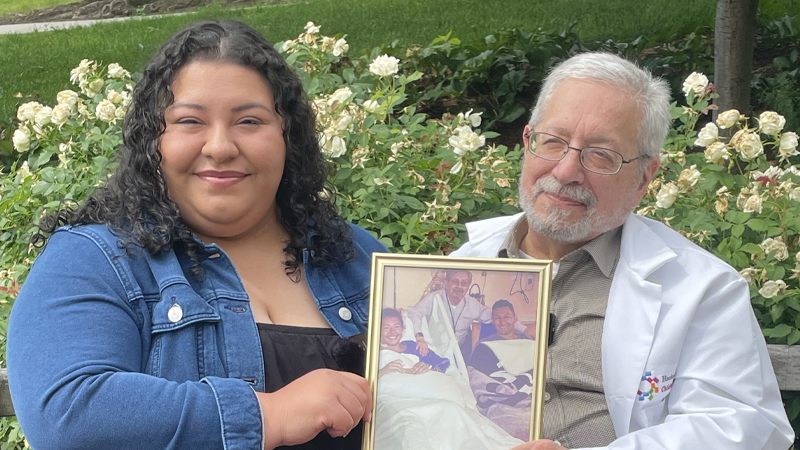 Lanay Lopez holds a framed photo of herself when she was in the hospital. 