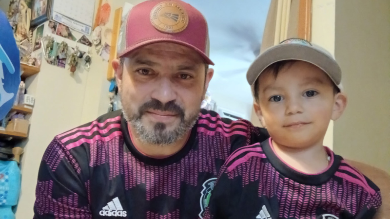 Jose Oliveres Estrade, 50, of Perth Amboy, New Jersey, poses next to a family member.