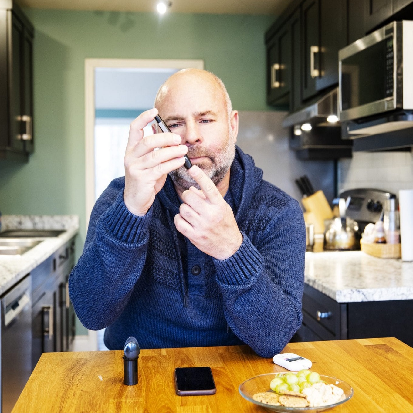 Male Diabetic Patient Pricking Finger