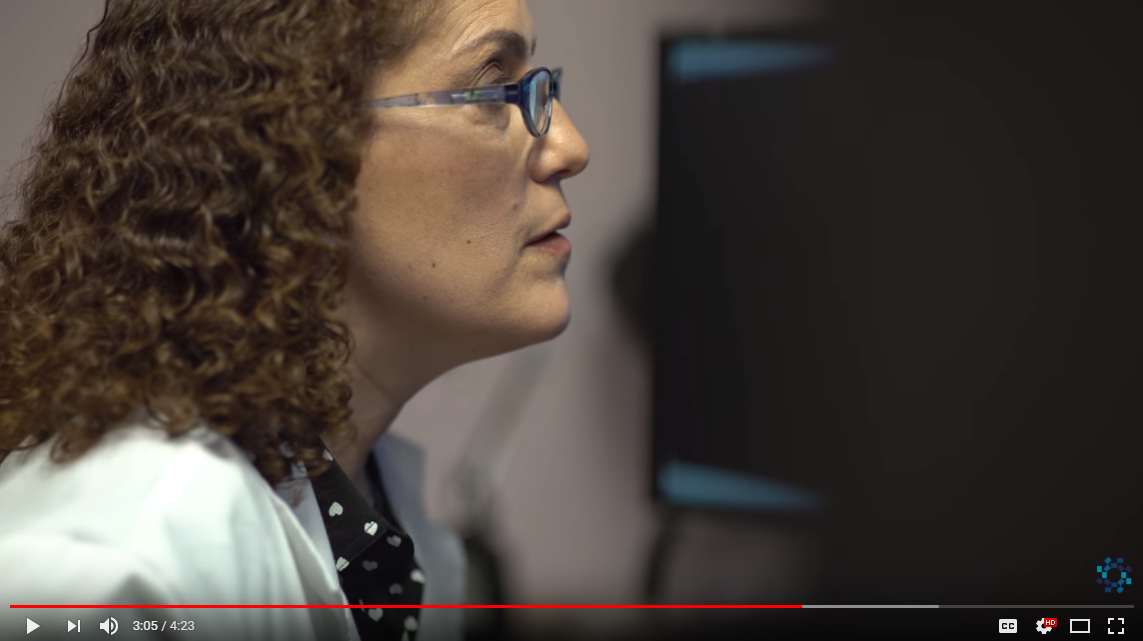 Gail Starr, M.D., M.S.Ed. looking at a computer