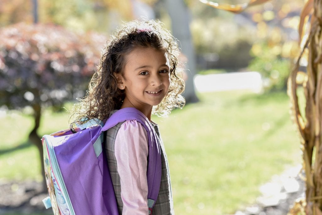 child with backpack