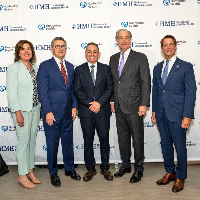 HMH and Hunterdon Health leaders posing at letter of intent signing