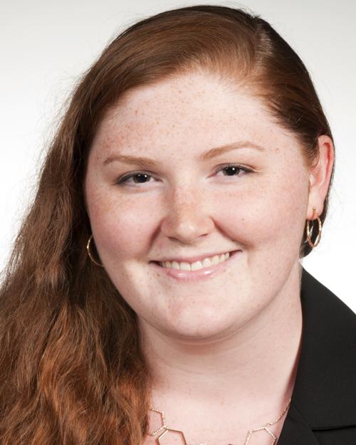 Women with long red hair wearing a black shirt