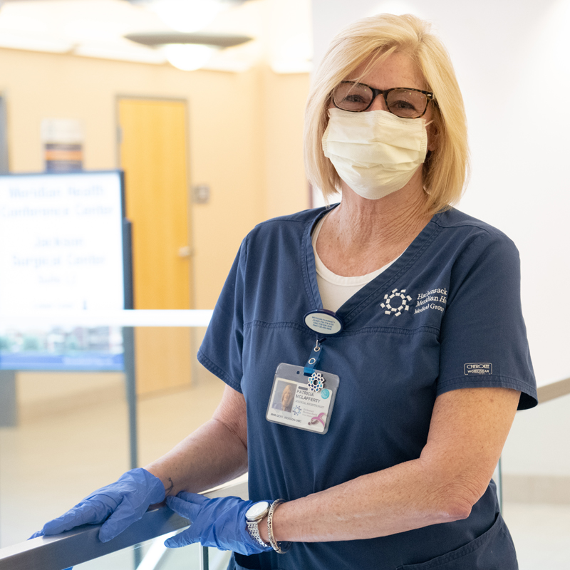 female provider in mask and gloves