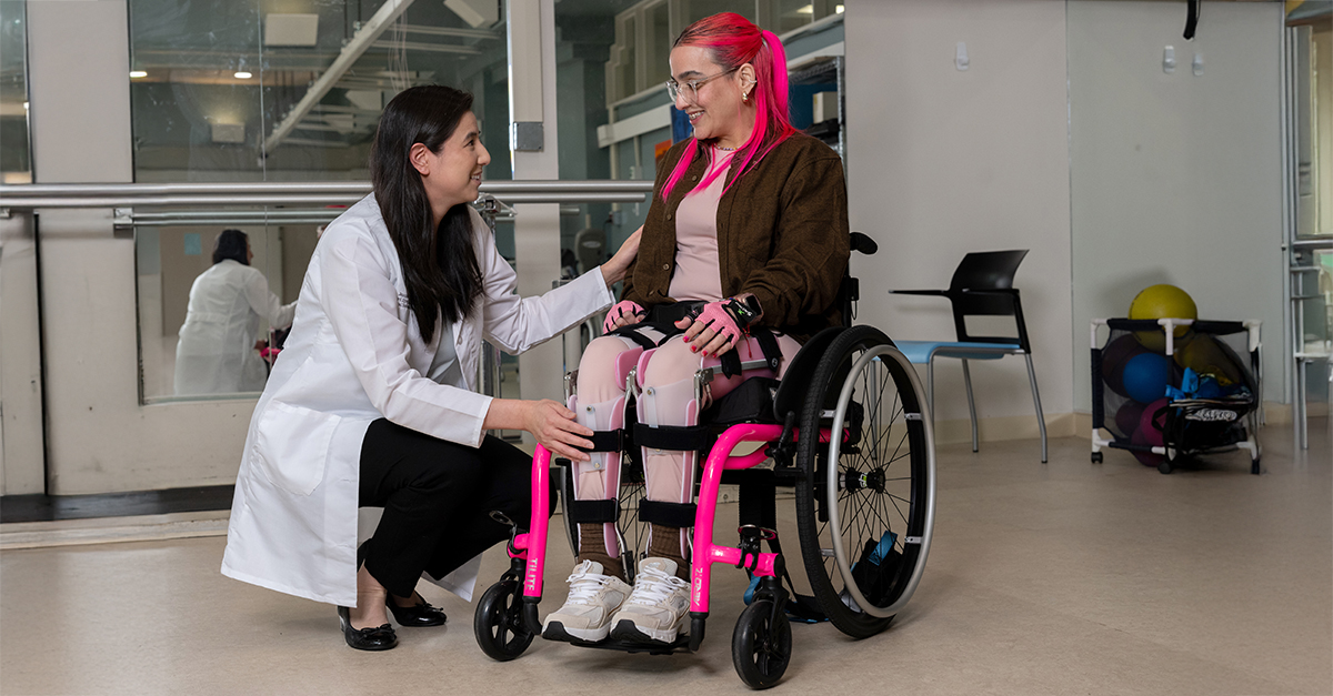 Woman in wheelchair with rehab doctor