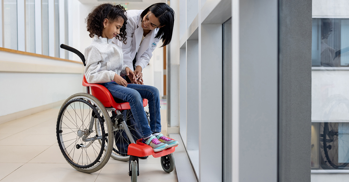 Rehab doctor with pediatric patient in wheelchair