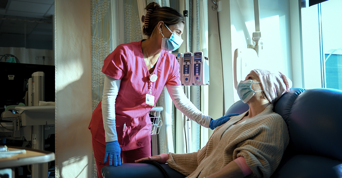 Oncology nurse with patient