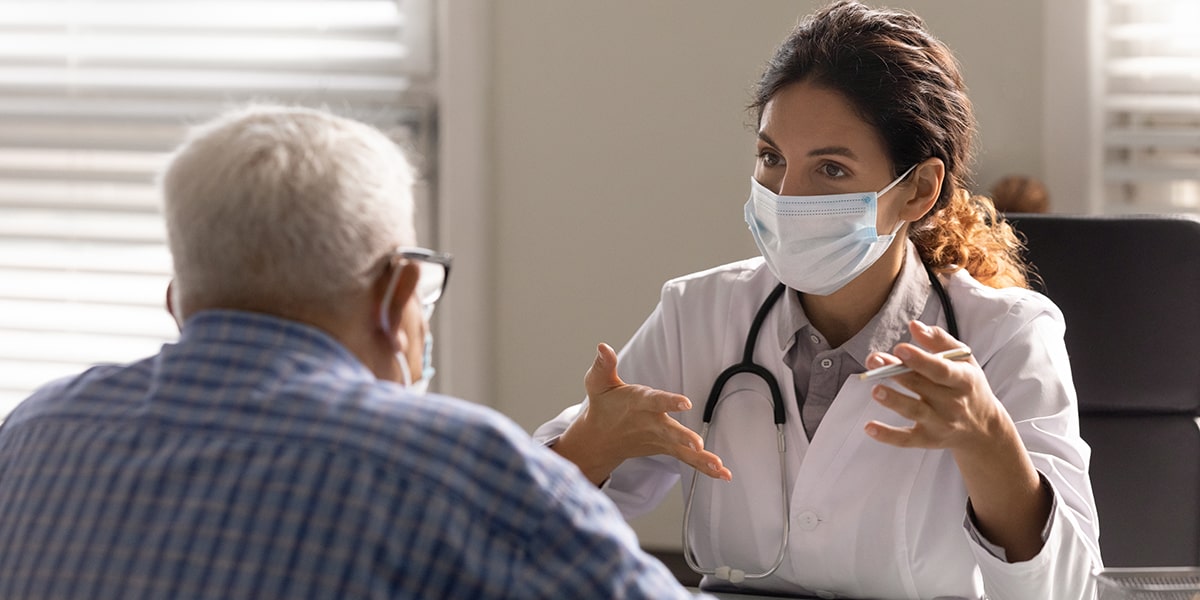 doctor and physician talking with masks on