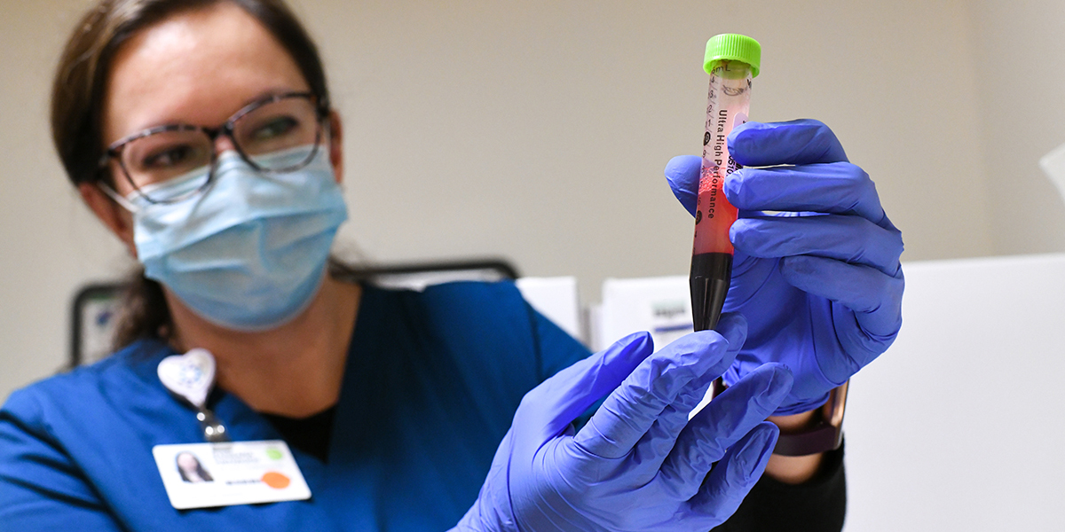 Medical professional with test tube