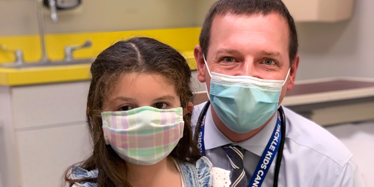 Adult doctor with pediatric patient