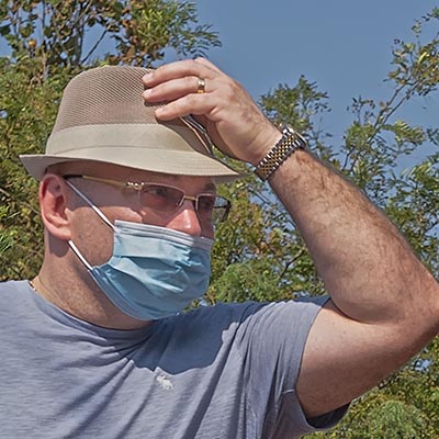 Man wearing a mask at the shore