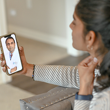 Woman completing a telehealth visit for WellBeing.