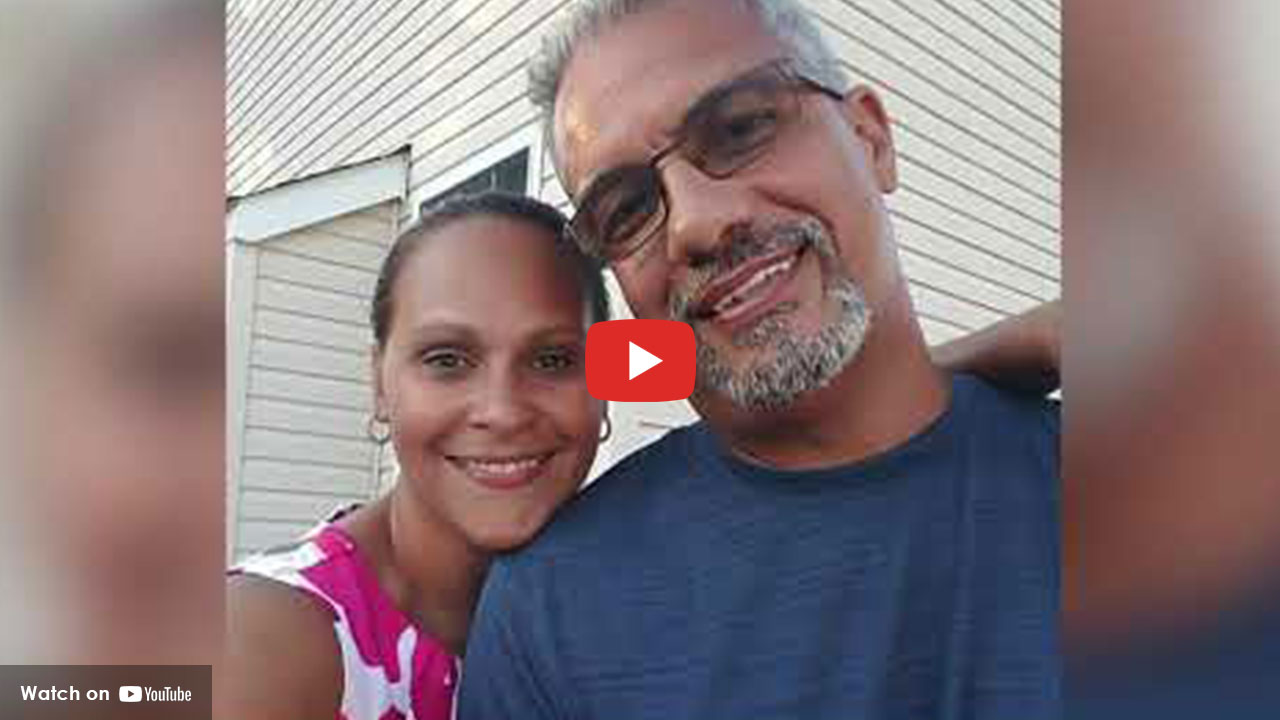 Woman and man smiling together outdoors