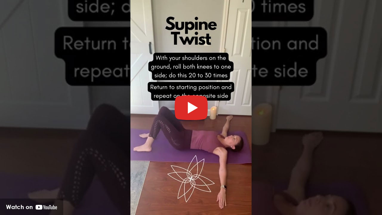 female laying down on floor stretching her back