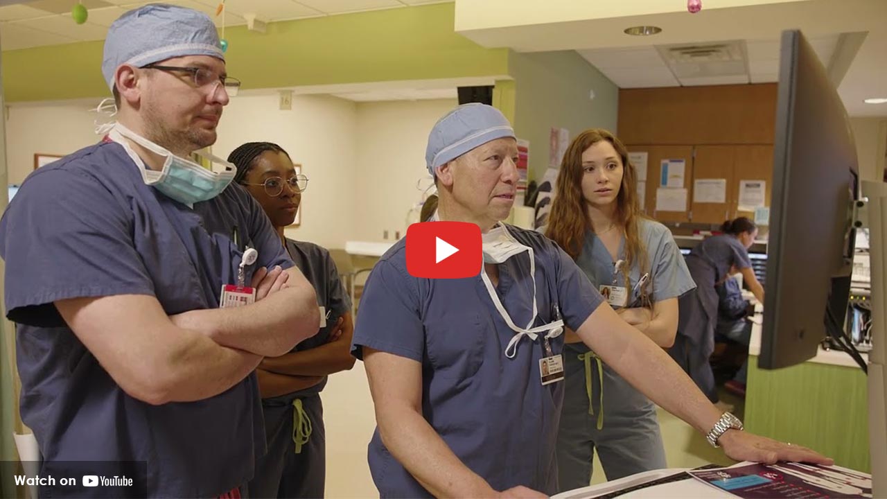 Surgery residents reviewing a patient case