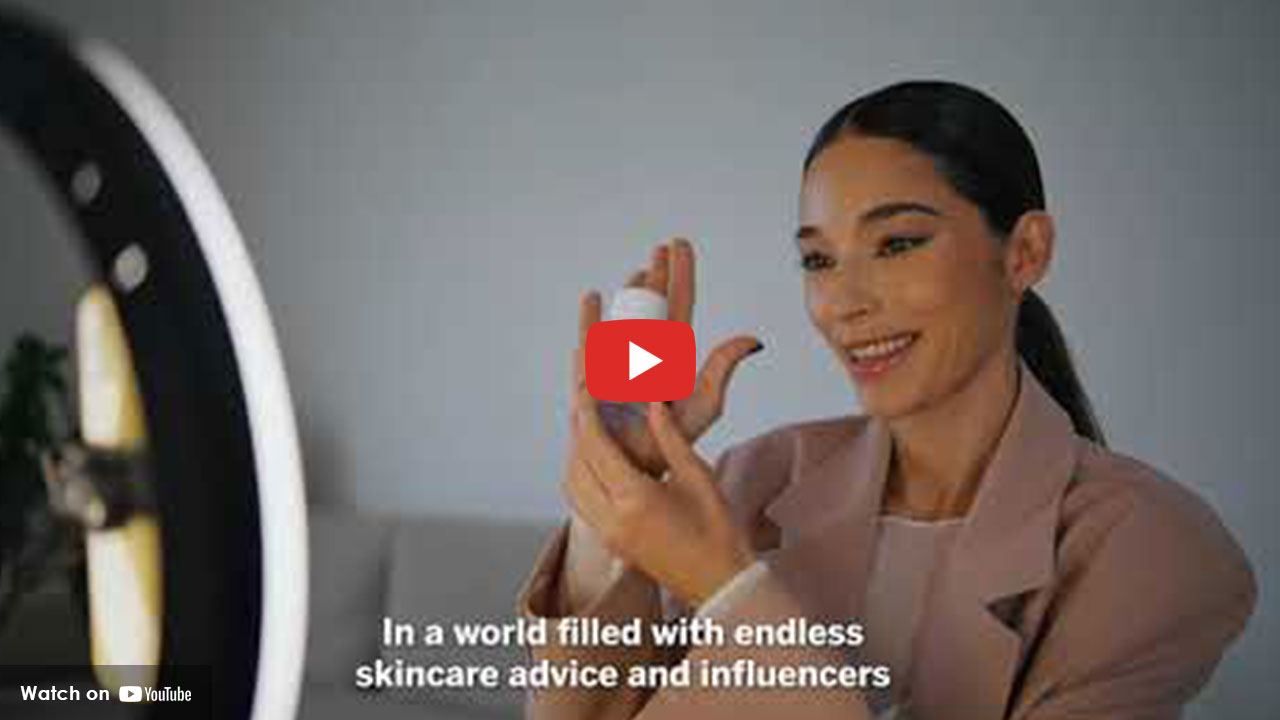 Woman applying skincare product while recording health content