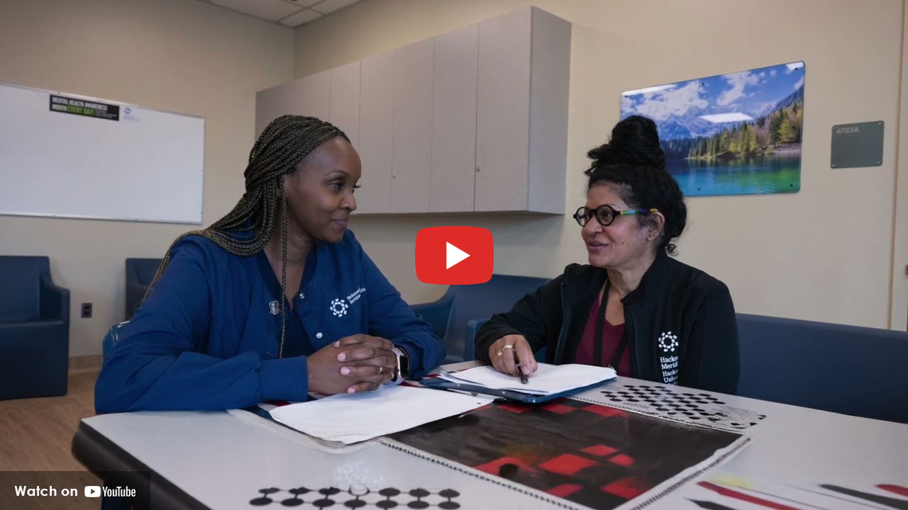 Care team member meeting with patient indoors