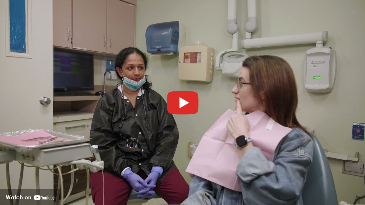 doctor with patient sitting in chair