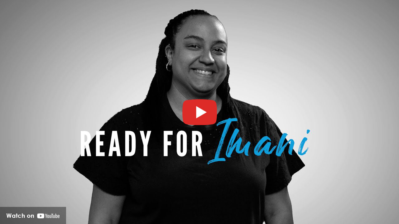 Smiling woman standing against a plain background with text reading “Ready for Imani”