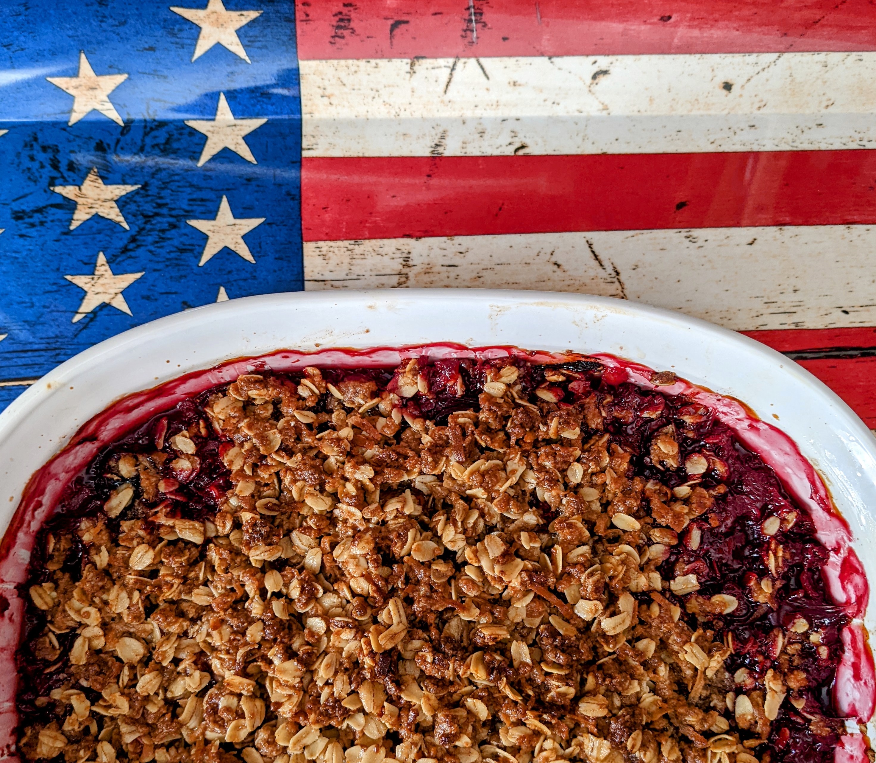 Fruit crisp dish in front of an American flag