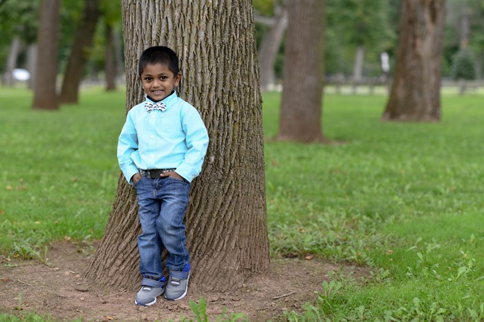 Young Boy Posing by Tree
