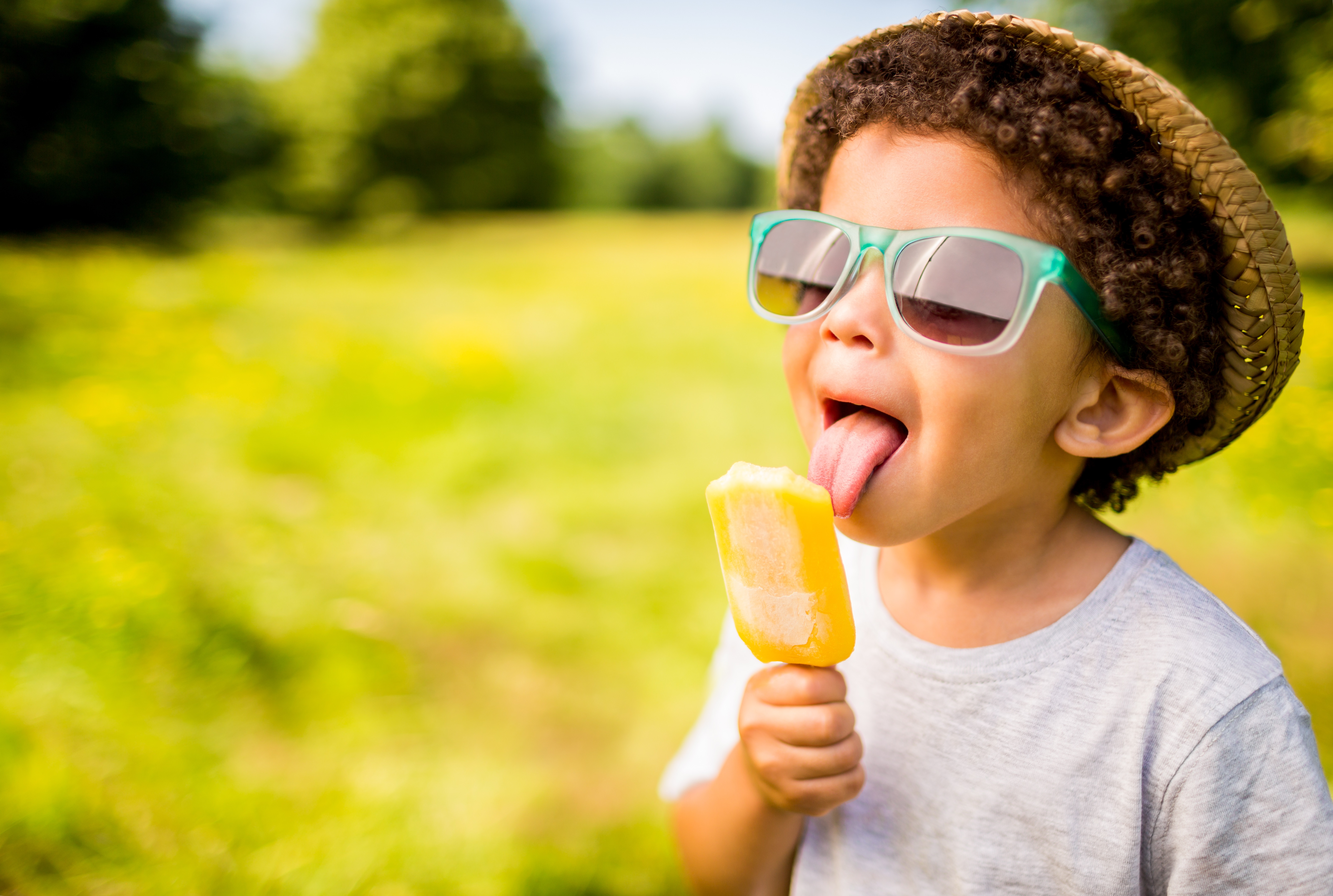Young Boy Licking Popsicle Enjoying Summer