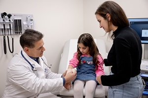 Dr Andrew Tellapi with Patient