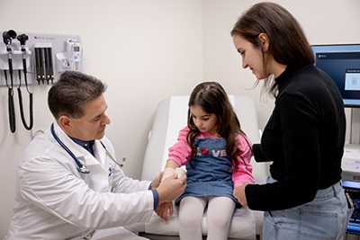 Dr Andrew Tellapi with Patient