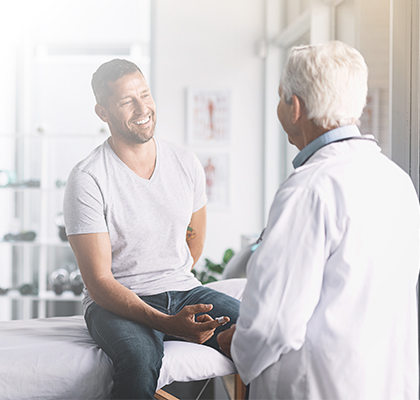 doctor giving his male patient checkup Image