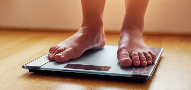 weight loss person on scale