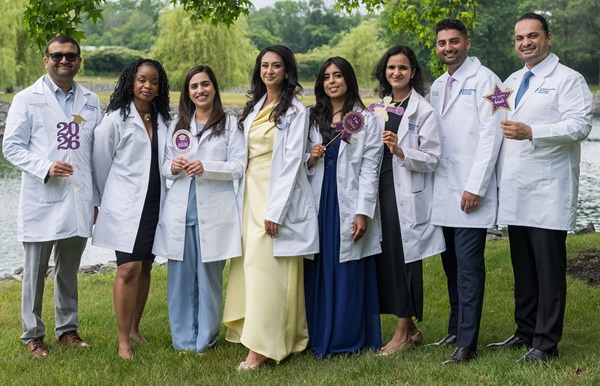 2026 JFK Internal Medicine Residency graduates posing together.