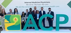 JSUMC Internal Medicine Residents standing behind an ACP sign.