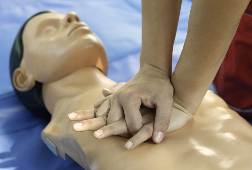 person learning CPR