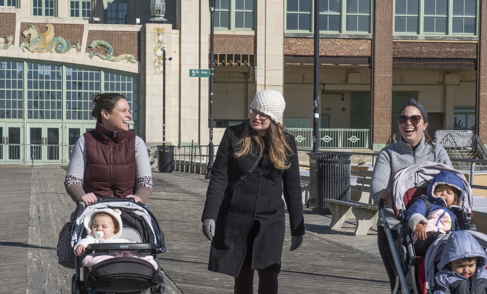Healthy trends women walking with babies on boardwalk