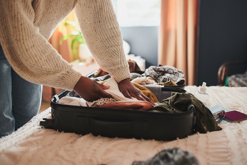 woman packing her things into a bag at home before a surgical stay; what to pack before surgery