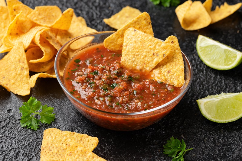 close up shot of chips and homemade salsa