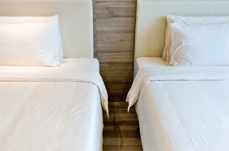 Sleep divorce concept - two beds next to each other.