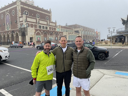 Gerald, Adam and Dr. Kaufman standing together in Asbury Park in front of Convention Hall for the half marathon race.