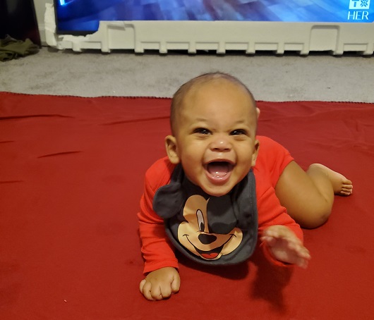 Baby Marcel crawling and happy