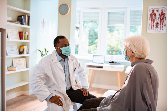 Doctor speaking with patient