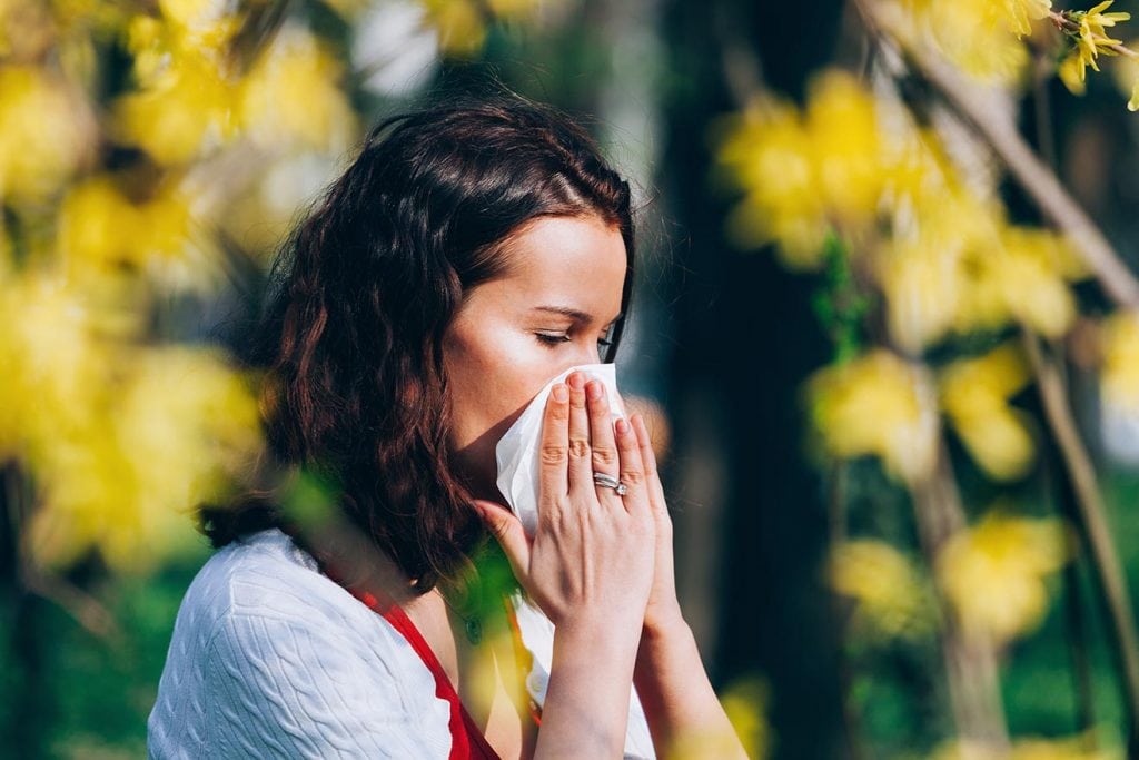 Woman In Garden with Tissue