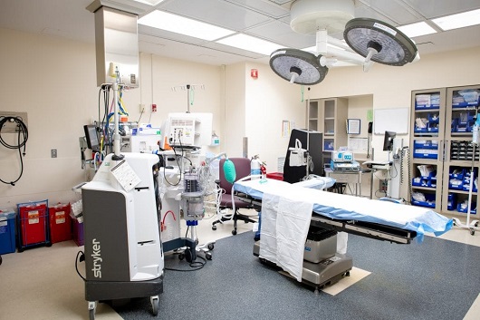 view of the operating room - table and lights set up for surgery